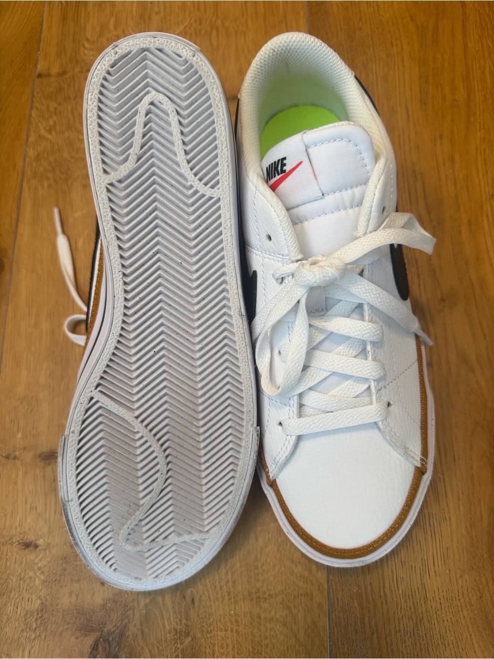 Nike White Sneakers with Black Swoosh and Brown Trim